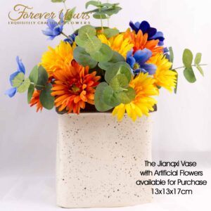 A rainbow of silk gerberas in this amazing bouquet with a handmade ceramic speckled vase